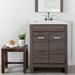 Devere light gray woodgrain bathroom vanity installed in bathroom with faucet and mirror