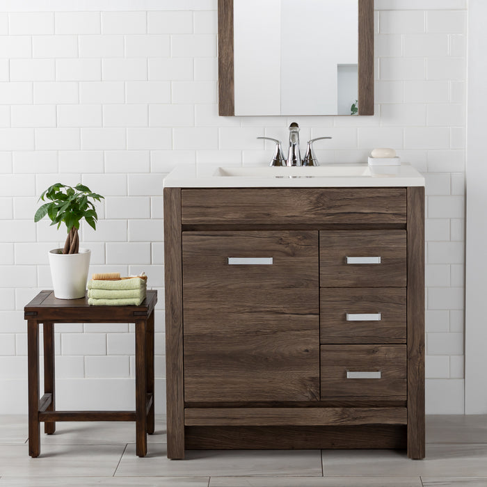 Devere dark woodgrain bathroom vanity with 3 drawers, cabinet, sink top installed in bathroom with faucet and mirror