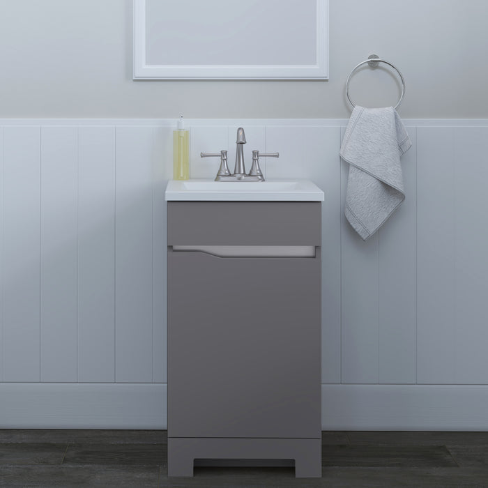 Brennan gray 18 inch hardware-free compact bathroom vanity with 1 door and white sink top installed in bathroom