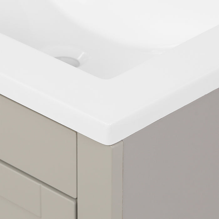 Corner closeup of sink on Lonsdale 24 inch warm gray half-bath vanity with two doors and white sink top