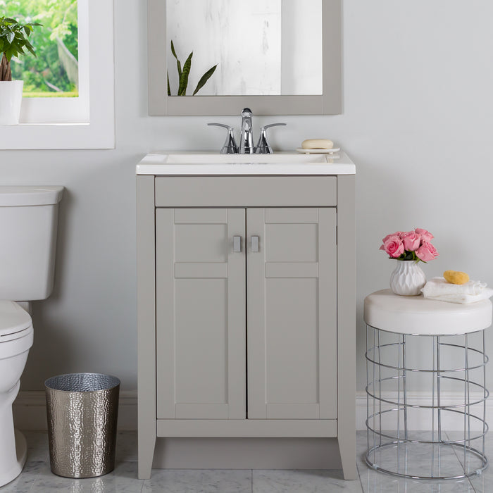 Lonsdale 24 inch gray half-bath vanity with two doors and white sink top installed in bathroom 