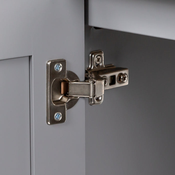 Image shows soft-close cabinet door hinge for 24.5” wide Marilla bathroom vanity, shown here in sterling gray finish with silver ash sink top