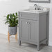 Front view of 24.5” wide Marilla bathroom vanity, shown here in sterling gray finish with silver ash sink top, mirror, hand soap and other bathroom items.