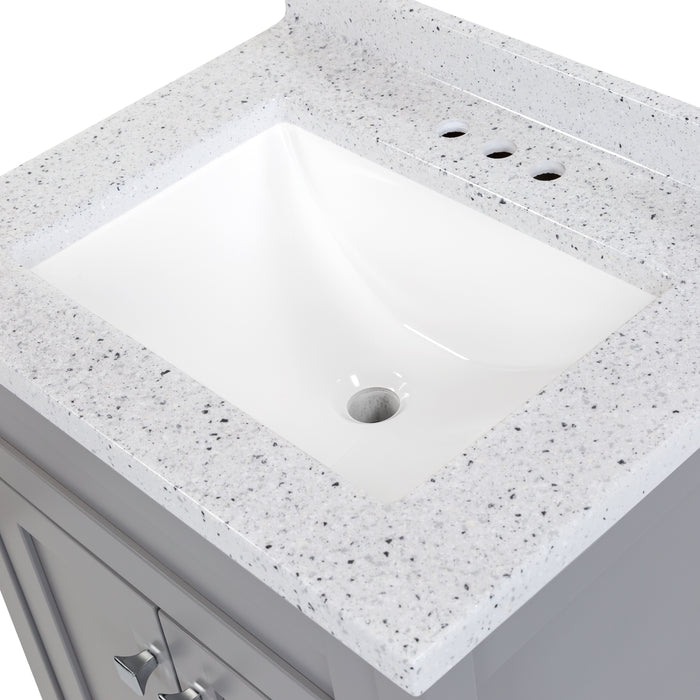 View of the 24.5” wide Marilla bathroom vanity cultured marble sink top with an integrated white sink that is predrilled for a 4" centerset faucet, and a 2.19" high backsplash  - shown here in silver ash sink top