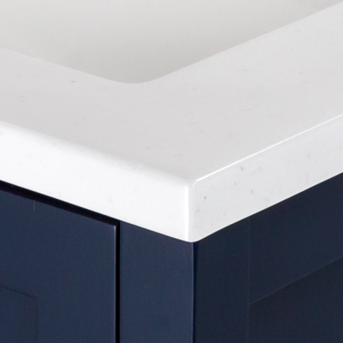 Close view of the corner of the 24.5” wide Marilla bathroom vanity cultured marble sink top with an integrated white sink and a 2.19" high backsplash  - shown here in white sink top