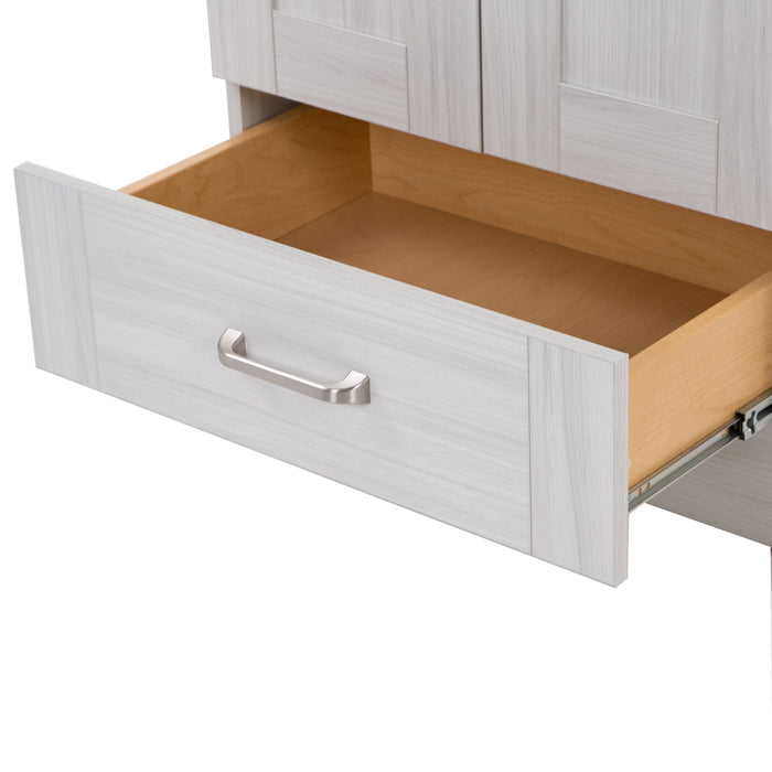 Close view of an extended drawer on the Noelani 24.25” wide powder room vanity features satin nickel hardware and an Elm Sky finish