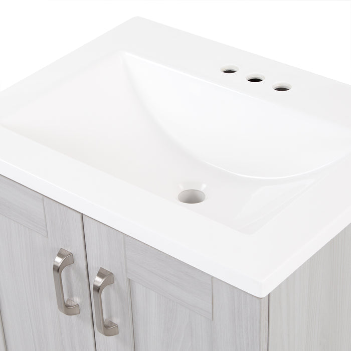View of Noelani 24.25” wide powder room vanity in Elm Sky finish features a transitional design with integrated, predrilled rectangular sink