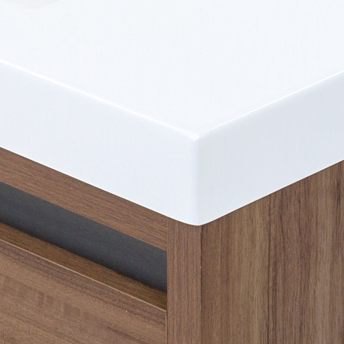 Corner detail on Trente 30 inch 2-door, 1-drawer, bathroom vanity with woodgrain finish and white sink top