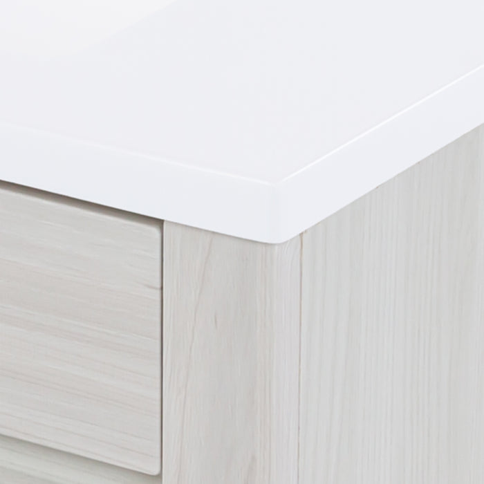 Close view of the corner of the 30.25" Devere freestanding single-sink vanity white cultured marble sink top with an integrated sink 