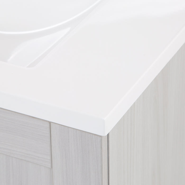 Close view of the corner of the 30.25" Noelani powder room vanity bright white cultured marble sink top with an integrated sink 