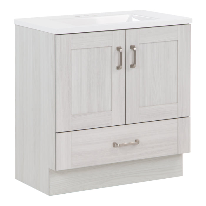 Angled side view of 30.25" Noelani powder room vanity features a transitional design with inset Shaker-style doors, a flat-panel drawer, and satin nickel door and drawer pulls – shown here in Elm Sky finish