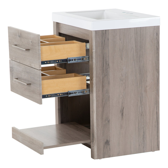 Two open drawers and pull-out shelf on Fisk 24.5" W woodgrain cabinet-style bathroom vanity, white sink top