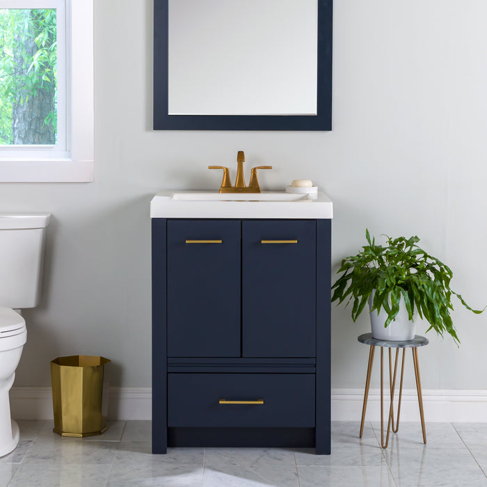 Hali 24.5 small blue bathroom vanity with 2-door cabinet, 1 drawer, brushed gold hardware, white sink top installed in bathroom with faucet and mirror