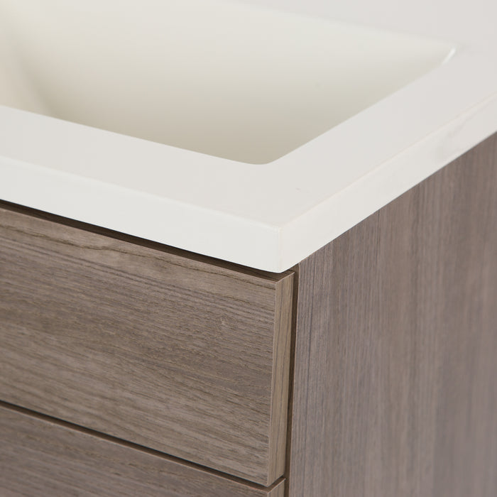 Closeup of corner off-white sink top on Hurley woodgrain finish bathroom vanity
