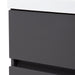 Closeup of edge of Innes 24.5" W gray floating bathroom vanity with flat-panel drawers, white sink top