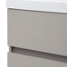 Closeup of edge of Innes 24.5" wide gray floating vanity with white sink top