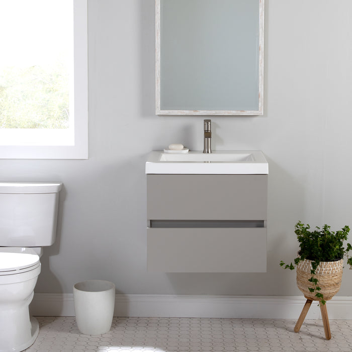Innes 30.5" W gray floating bathroom vanity installed in bathroom with mirror and plant