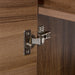 Closeup of 6-way adjustable hinges on Kelby 48.5" W floating vanity with woodgrain finish