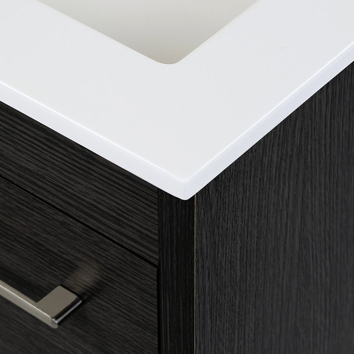 Closeup of corner of white cultured marble sink top on Lir 24.5" W dark woodgrain cabinet-style bathroom vanity 