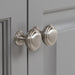 Satin nickel door pulls with circle details on Maris 24.5" 2-door gray Powder Room Vanity, stone-look sink top