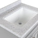 Close up of predrilled natural stone-look vanity top with integrated white sink of Maris 24.5" 2-door gray Powder Room Vanity