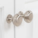 Satin Nickel round door pulls with circle details on Maris 24.5" 2-door White Powder Room Vanity, stone-look sink top