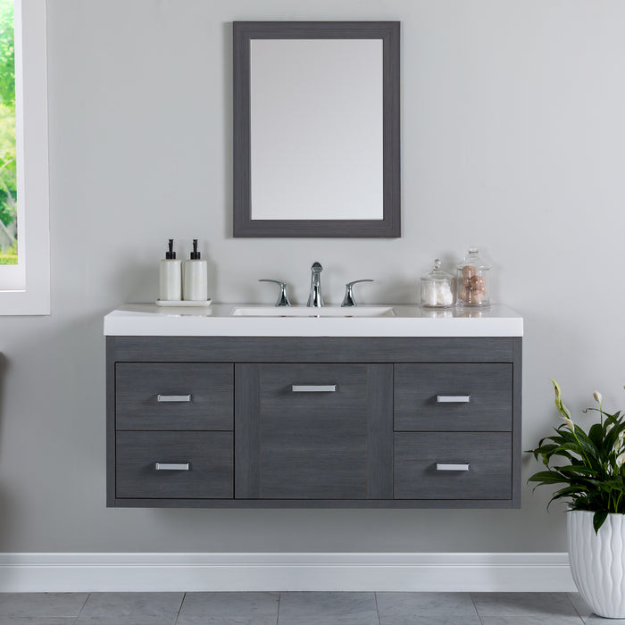Marlowe 48.5 in gray woodgrain floating bathroom vanity with 1-door cabinet, 4 drawers, polished chrome hardware, and white sink top mounted on bathroom wall with faucet and mirror