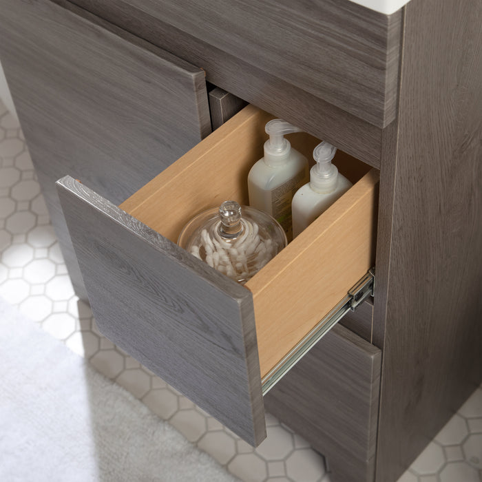 Open drawer with natural wood finish interior medium woodgrain flat panel front on Muriel 24.5" W cabinet-style bathroom vanity