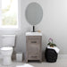 Nixie 18.5" wide woodgrain 1-door, 1-drawer bathroom vanity installed in bathroom with plant and toilet