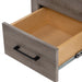 Closeup of open drawer with woodgrain finish front, natural finish interior