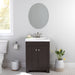 Wharton 24.5" W dark woodgrain shaker style bathroom vanity with white sink top installed in bathroom with faucet