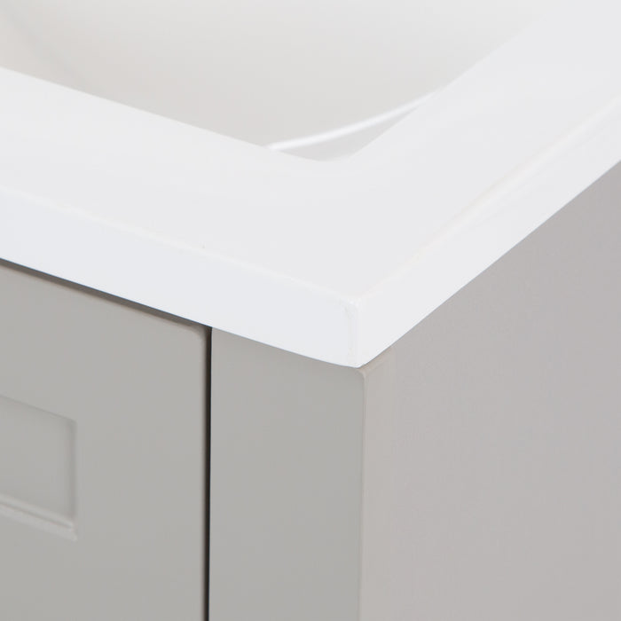 Closeup of corner of white sink top on Wyre 18.25" W gray bathroom vanity by Spring Mill Cabinets