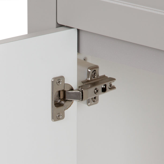 Closeup of 6-way adjustable hinges on white interior of Wyre 18.25" W gray bathroom vanity 