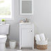 Wyre 18.25" W white Shaker-style vanity with 1 flat-panel door, white sink top installed in bathroom with toilet and plant