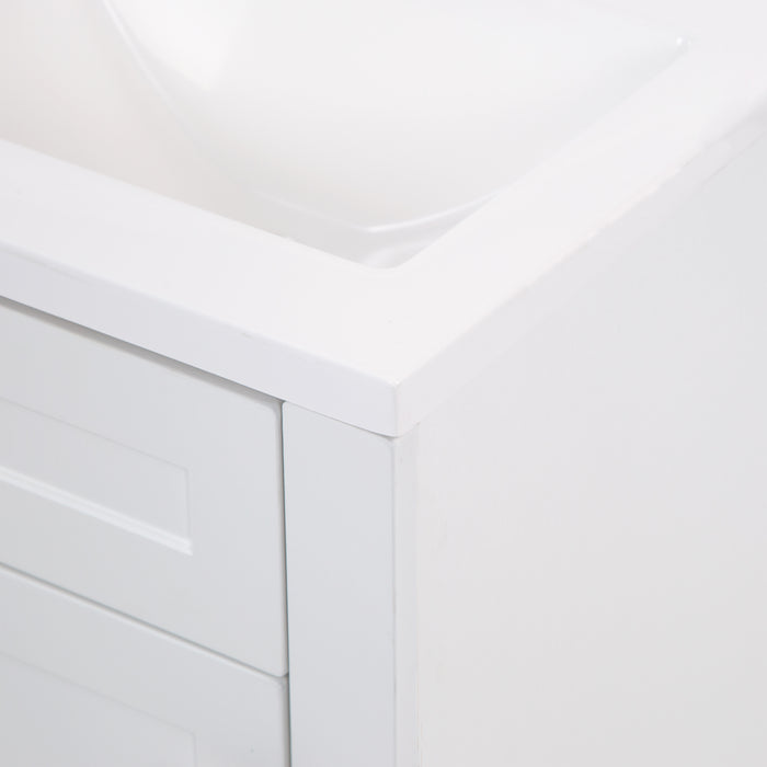 Closeup of corner of white sink top on Wyre 18.25" W white bathroom vanity by Spring Mill Cabinets