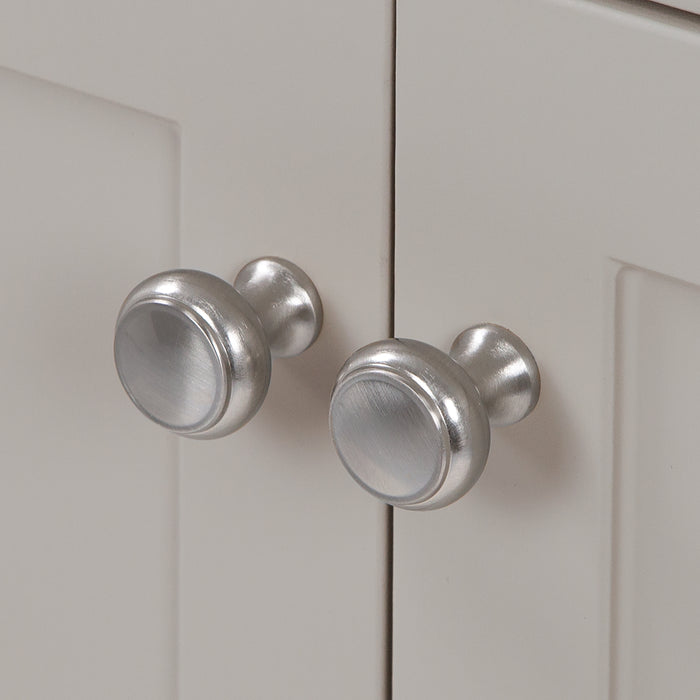 Satin Nickel door knobs on Wyre 24.5" W gray Shaker-style bathroom vanity 