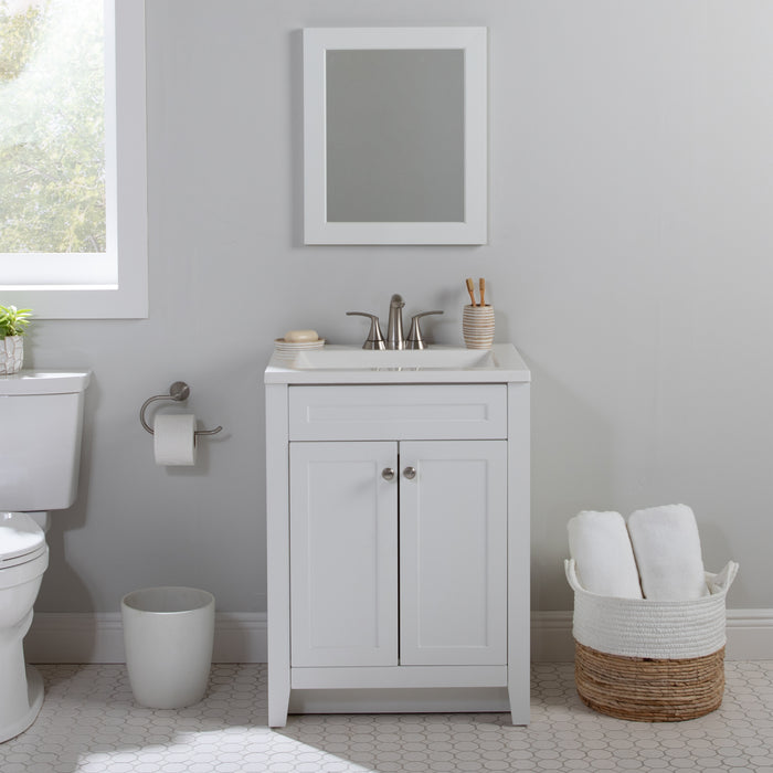 Wyre 24.5" W white Shaker-style vanity with 2 flat-panel doors, white sink top installed in bathroom with toilet and mirror