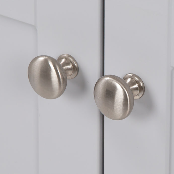 Brushed Nickel door knobs on Yereli 24.25" W gray Shaker-style bathroom vanity 