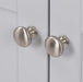 Brushed Nickel door knobs on Yereli 24.25" W gray Shaker-style bathroom vanity 