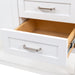 Open lower drawer on 36.5 in. Eaton white bathroom vanity with drawers, open shelf, adjustable legs, and brushed nickel handles with granite-look sink top