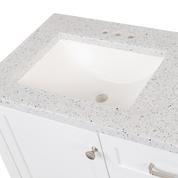 Closeup on sink top of 36.5 in. Eaton white bathroom vanity with drawers, open shelf, adjustable legs, and brushed nickel handles with granite-look sink top