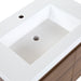 Predrilled white cultured marble sink top with integrated rectangular sink on Kelby vanity with woodgrain finish