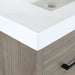 Closeup of corner on Rialta 30.5" W 3-drawer bathroom vanity with woodgrain finish, white sink top